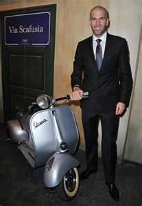 Sporting the Vespa with a Suit and Tie
